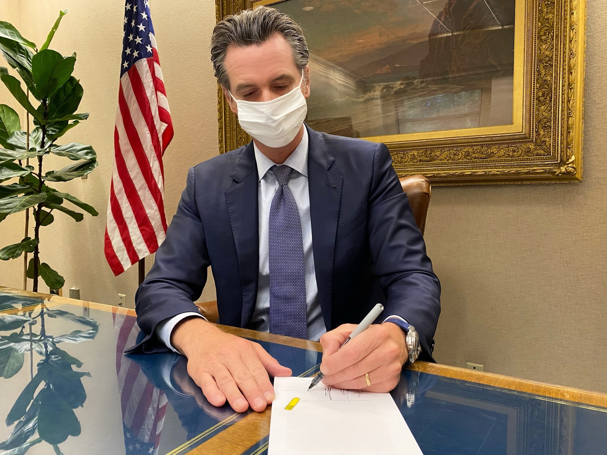 photo of California Governor signing a bill