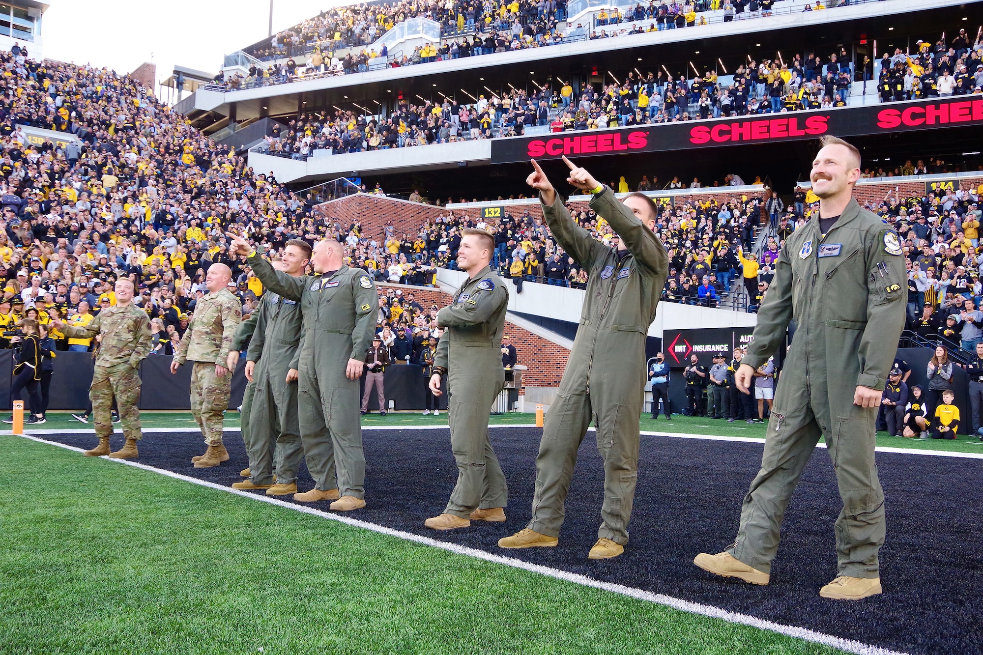 Aircrew from the 85th Air Refueling Wing are honored in the end zone at Kinnick Stadium in Iowa City, Iowa on Oct. 16 ,2021.