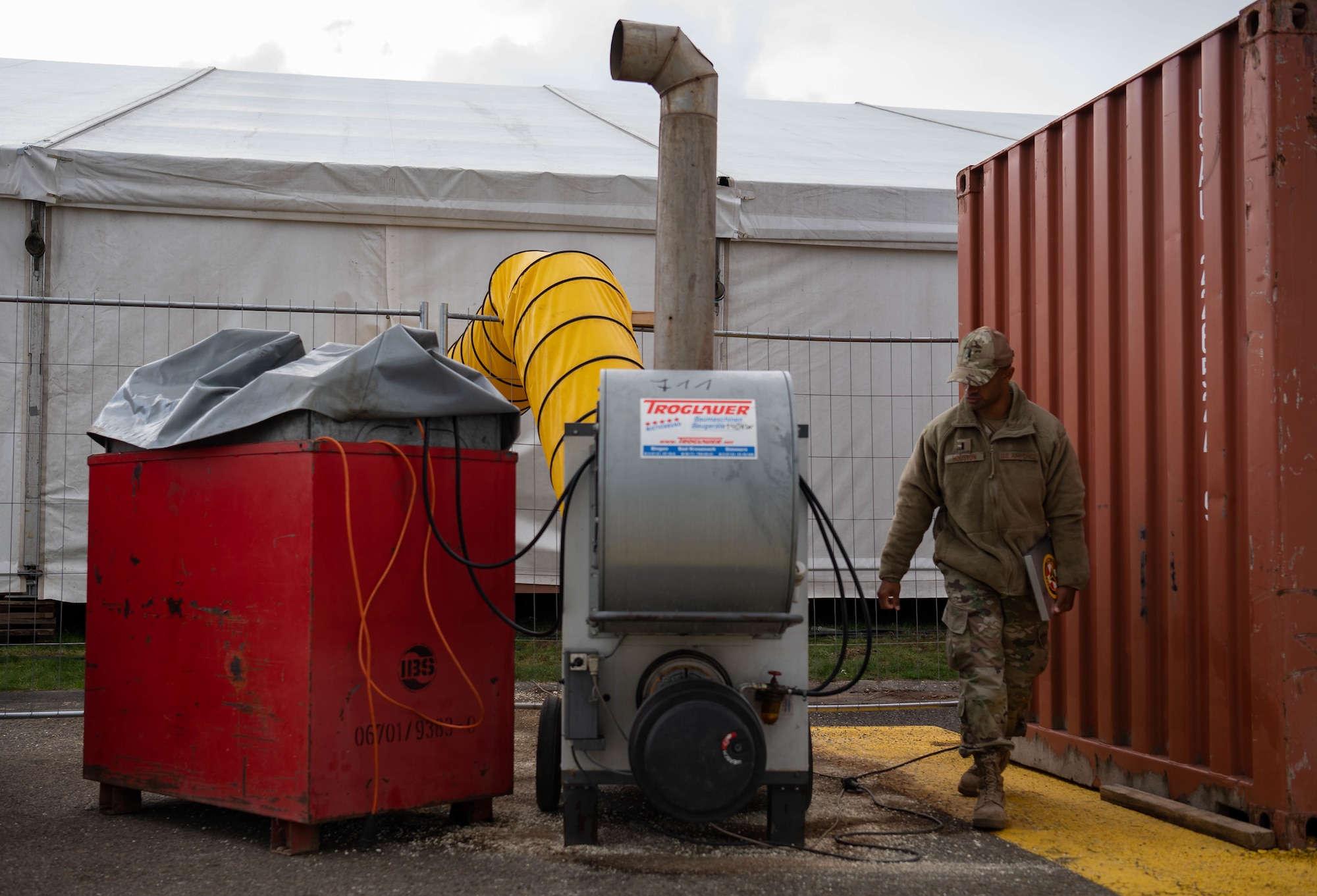 U.S. Air Force 1st Lt. Gabriel Houston, 786th Civil Engineer Squadron engineering chief, inspects a heater on Ramstein Air Base, Germany, Oct. 13, 2021. Houston is responsible for the infrastructure within the pods. (U.S. Air Force photo by Airman Jared Lovett)