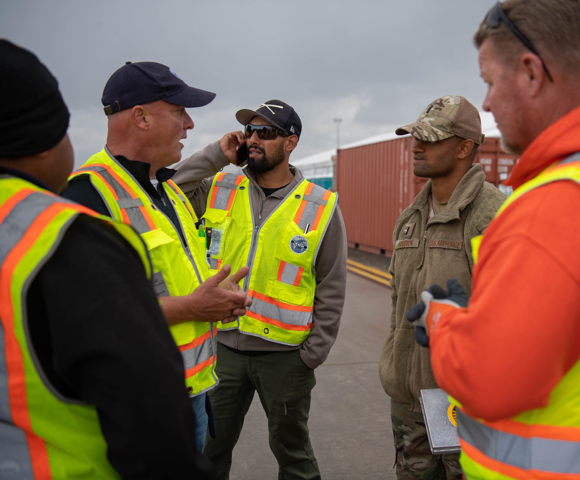 U.S. Air Force 1st Lt. Gabriel Houston, 786th Civil Engineer Squadron engineering chief, discusses an issue with a heater with contractors at Ramstein Air Base, Germany, Oct. 13, 2021. Houston worked with all of the different squadrons to ensure that the evacuees had all of their needs met while they were here.  (U.S. Air Force photo by Airman Jared Lovett)