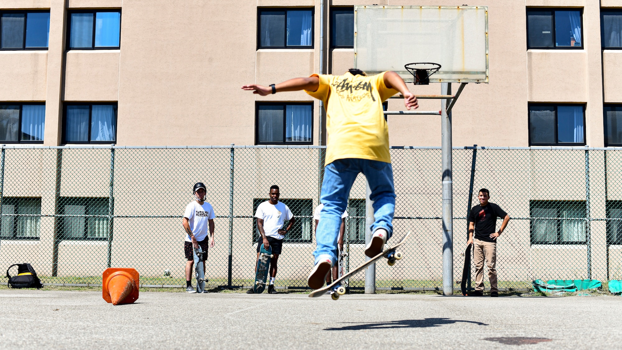 An Airman skateboards.