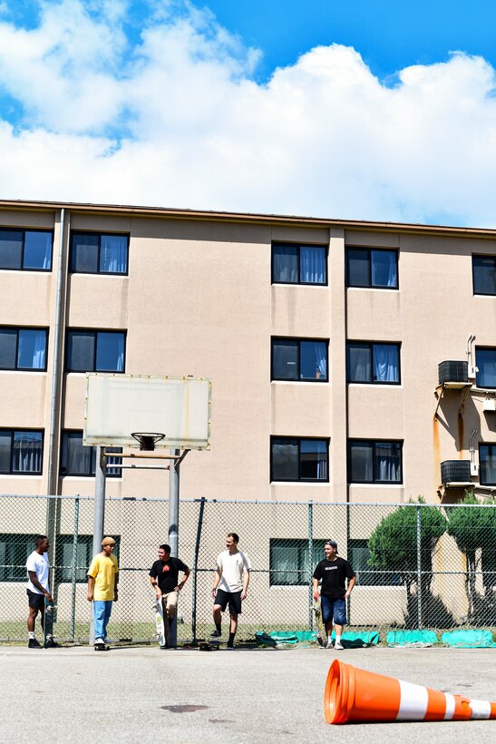Service members arrive at a skatepark.