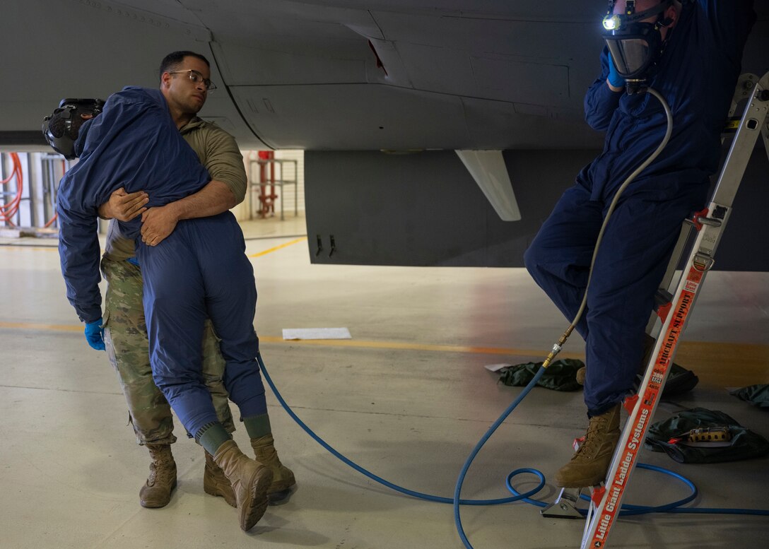 The 100th MXS practiced responding to an Airman losing consciousness inside of a fuel cell due to lack of oxygen while performing maintenance.