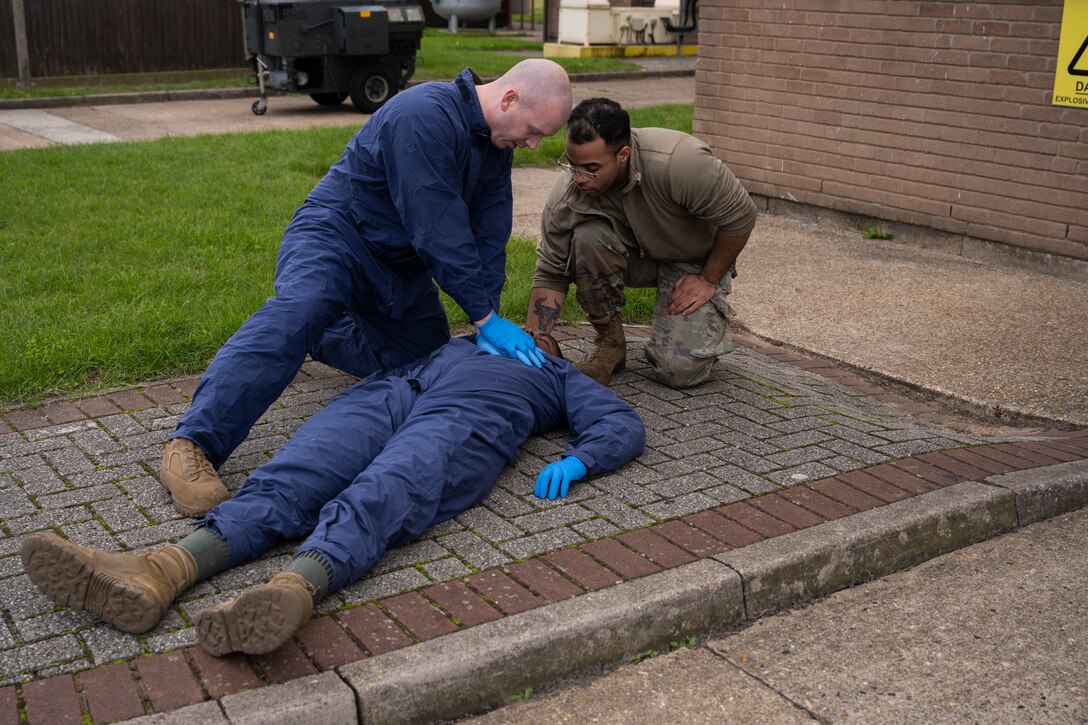 The 100th MXS practiced responding to an Airman losing consciousness inside of a fuel cell due to lack of oxygen while performing maintenance.