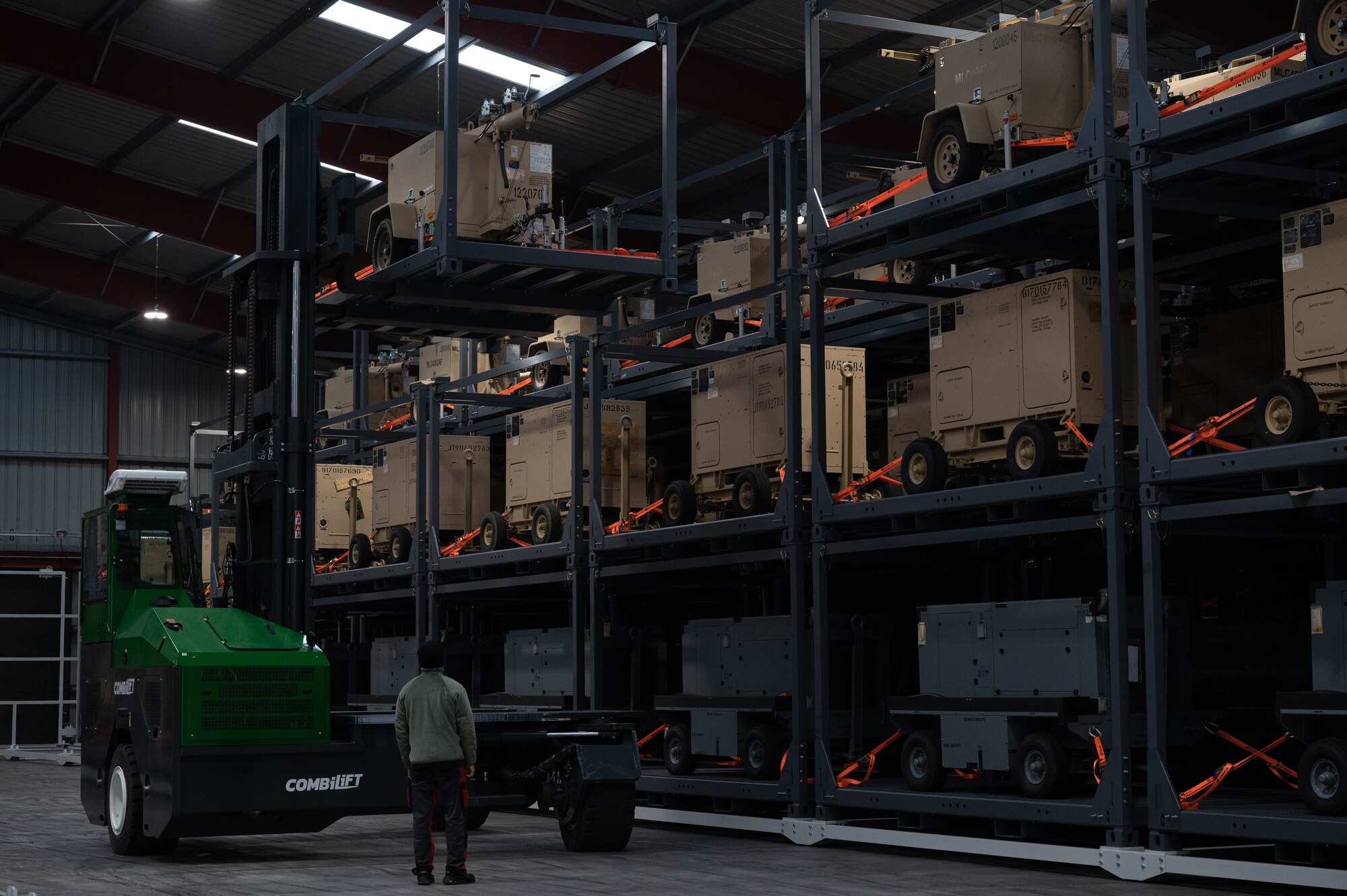 Members of the Warehouses Service Agency operate a forklift.