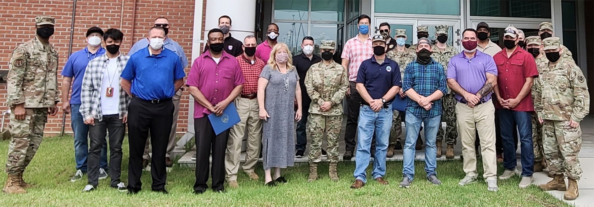 Group of masked men and women who participated in the DLA Indo-Pacific RDT Blue team exercise on the Korean Peninsula.