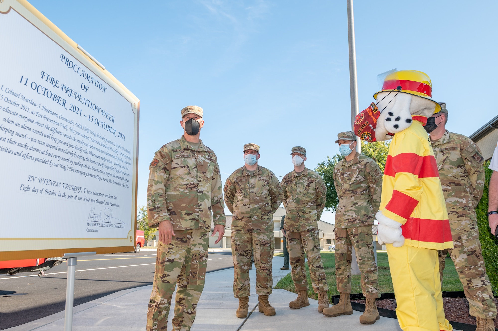 Col. Matt Husemann, 436th Airlift Wing commander, speaks to members of the 436th Civil Engineer Squadron after signing the proclamation officially declaring Oct. 11-15 “Fire Prevention Week 2021” at Dover Air Force Base, Delaware, Oct. 8, 2021. Fire Prevention Week is an annual observance to educate the Dover AFB community about the importance of fire prevention. (U.S. Air Force photo by Mauricio Campino)