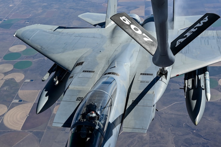 An F-15C assigned to the 85th Test and Evaluation Squadron, Eglin Air Force Base, Florida, receives fuel from a KC-135 assigned to the 465th Air Refueling Squadron, Tinker AFB, Oklahoma, Oct. 15, 2021. In-air refueling allows fighter aircraft to stay airborne for longer periods of time without having to land to refuel.  (U.S. Air Force photo by 2nd Lt. Mary Begy)