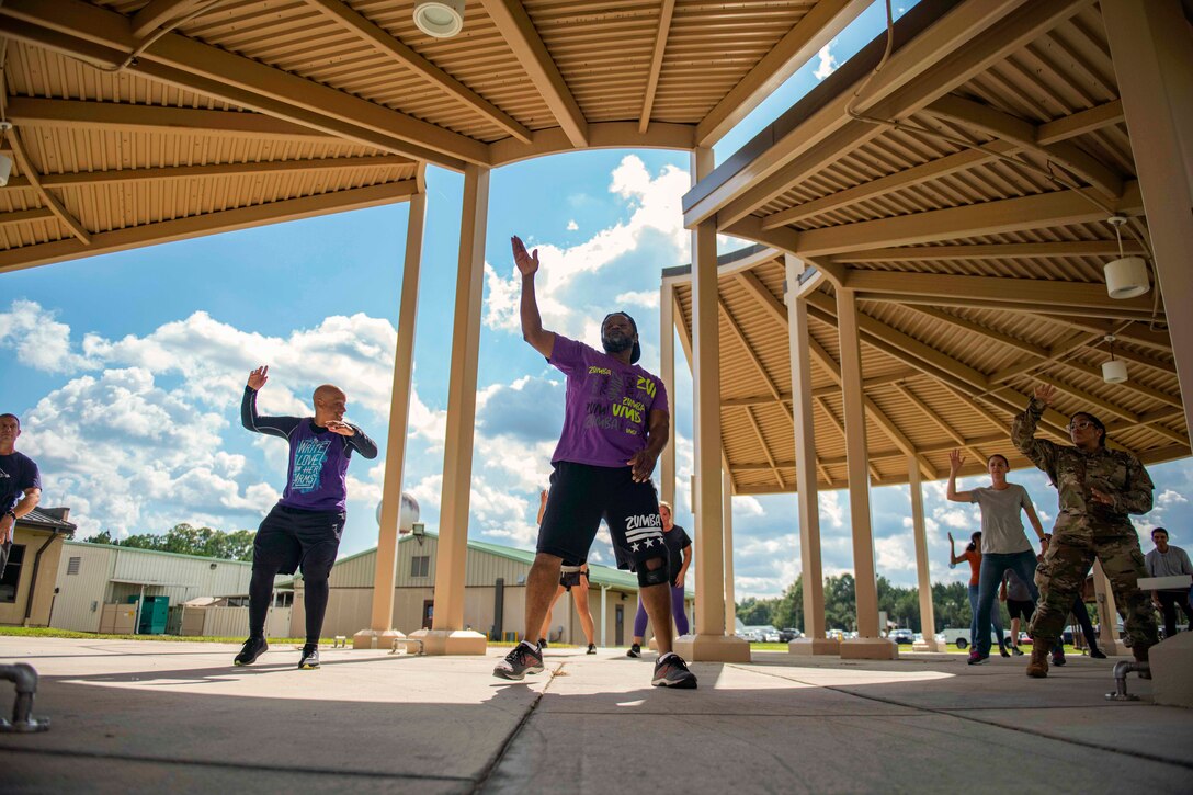 Airmen participate in a Zumba class.