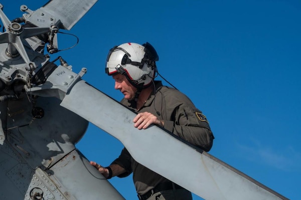 HSC-23 Sailor Conducts Pre-flight Check