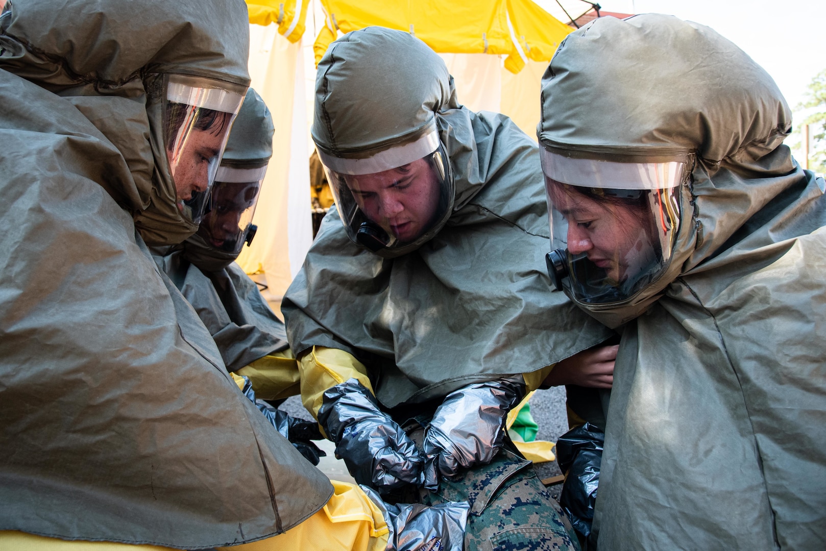 A Sailor serving aboard Naval Health Clinic Cherry Point simulates administering Atropine to a mannequin while conducting a practical exercise demonstrating his proficiency at patient decontamination Thursday, October 14 aboard Marine Corps Air Station Cherry Point.  Sailors assigned to the clinic participated in a multi-day training program to sharpen their skills at safely removing hazardous materials from patients.