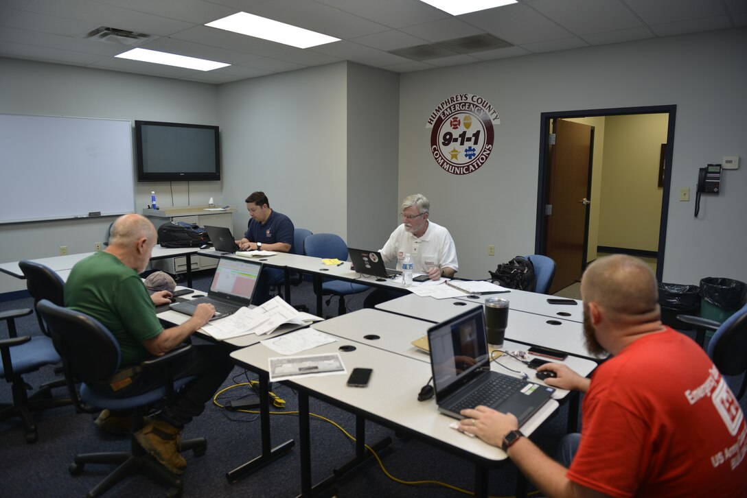 USACE Emergency Operations team gathers together to compile data and costs.