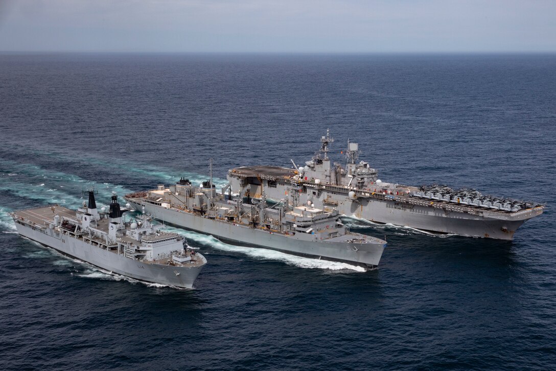 NORTH SEA (May 9, 2021) The Wasp-class amphibious assault ship USS Iwo Jima (LHD 7), right, the fast combat support ship USNS Supply (T-AOE 6) and the Royal Navy landing platform dock ship HMS Albion (L 14) conduct a replenishment-at-sea, May 9, 2021. Iwo Jima is operating in the Atlantic Ocean with Amphibious Squadron 4 and the 24th Marine Expeditionary Unit (24th MEU) as part of the Iwo Jima Amphibious Ready Group. (U.S. Navy photo by Mass Communication Specialist 3rd Class Jessica Kibena)