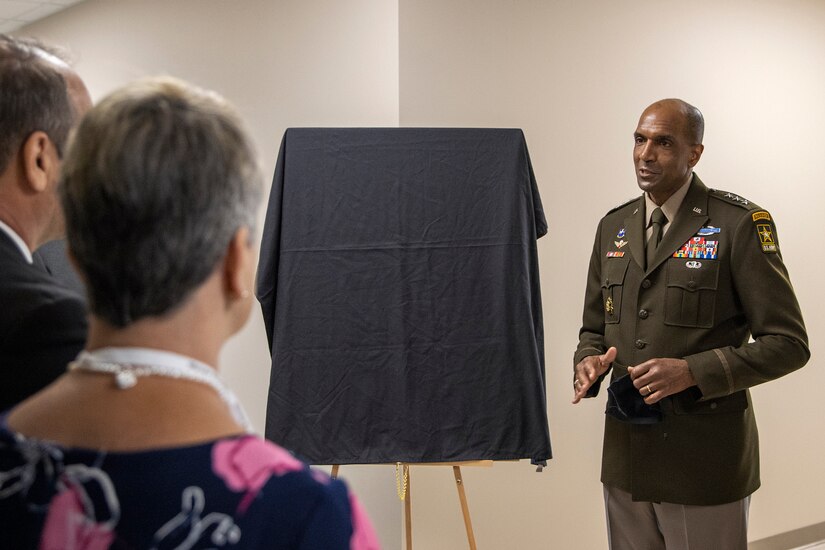 Lt. Gen. Gary M. Brito, U.S. Army Deputy Chief of Staff, G-1, talks with the parents of Michael G. Sauro, a former Defense Ammunition Center hazardous material instructor who lost his life while deployed as a civilian in support of Operation Freedom’s Sentinel, during a building dedication ceremony at Camp Atterbury, Ind., June 3, 2021. Sauro had Building 444 on the installation named after him, and Brito said the Sauro family would always be part of the larger Army family. (U.S. Army photo by Mark R. W Orders-Woempner)