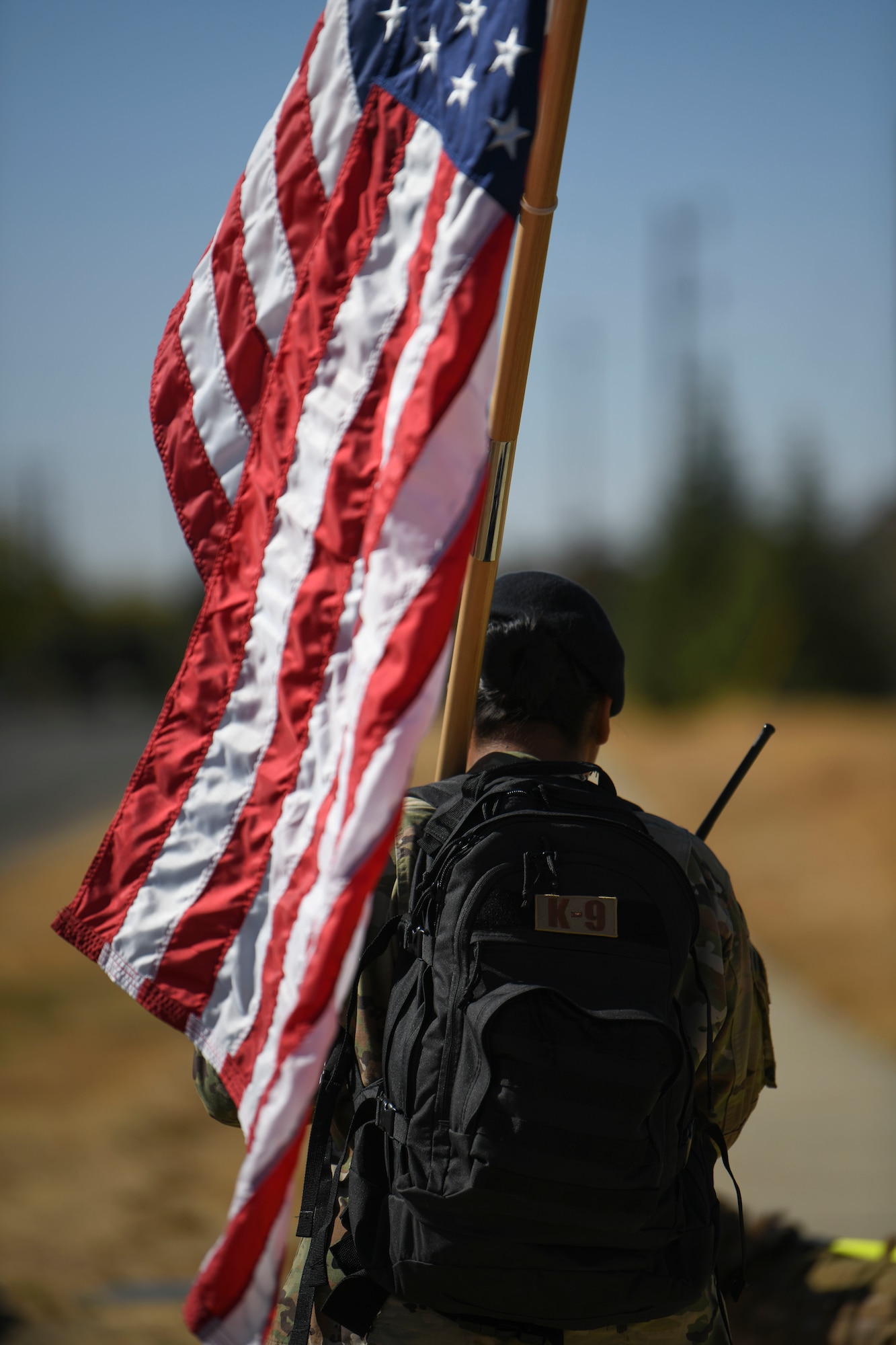 A 9th Security Forces Squadron (SFS) Airman carries the U.S. flag Oct. 14, 2021, at Beale Air Force Base, California.