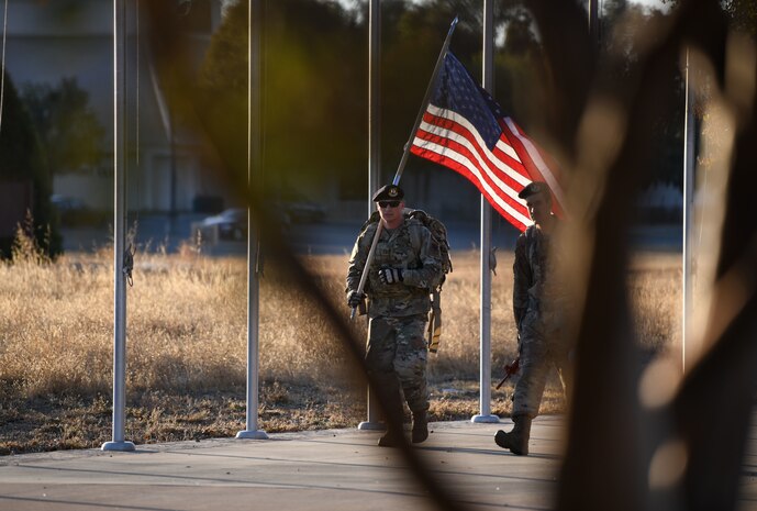 Airmen from the 9th Security Forces Squadron ruck with the U.S. flag, Oct. 15, 2021 at Beale Air Force Base, California.