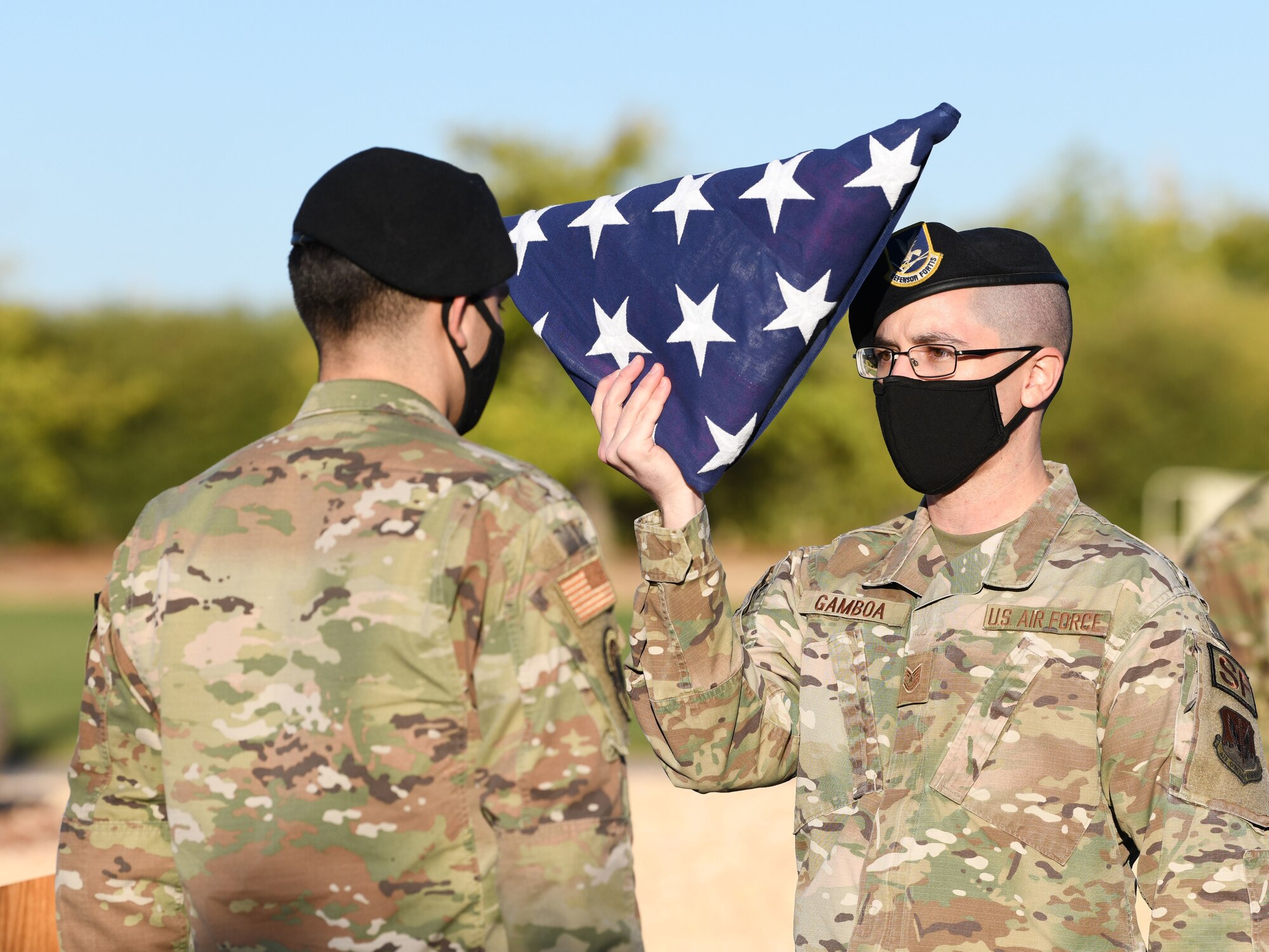 Airmen from the 9th Security Forces Squadron fold the U.S. flag during Police Week’s remembrance ceremony, Oct. 15, 2021 at Beale Air Force Base, California.