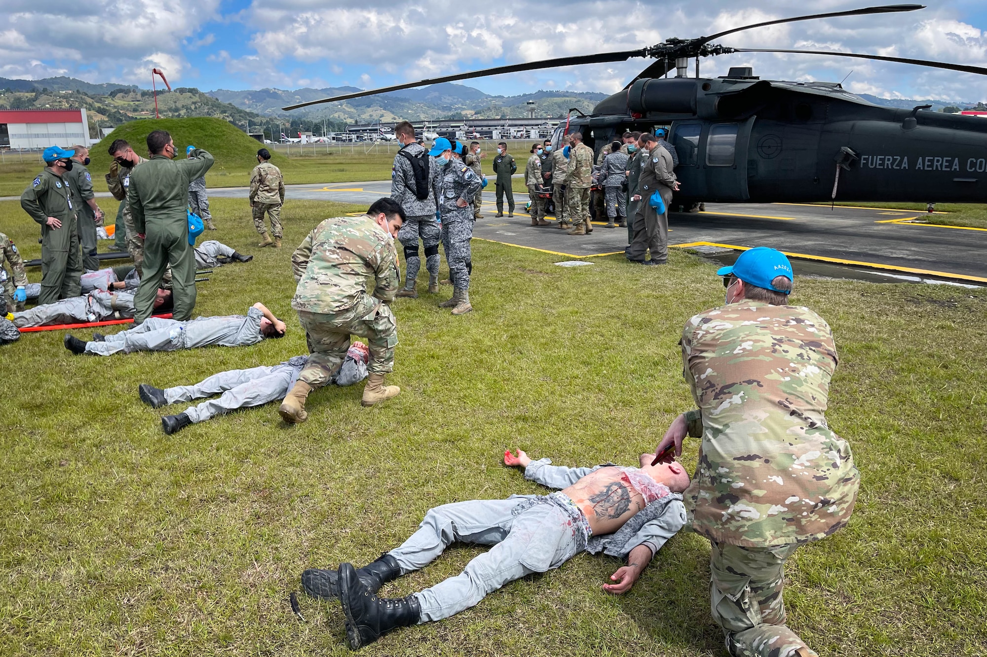 Rionegro, Colombia - U.S. Air Force Airmen and Airmen from several partner countries’ Air Forces conduct simulated medical training during exercise Angel de los Andes at Jose Maria Cordova International Airport in Colombia, Sept. 3, 2021. Reserve Citizen Airman Lt. Col. Heleno Souza, 944th Aeromedical Staging Squadron chief administrator, participated in this two-week multinational, Colombian led exercise Aug. 30-Sept 10 that focused on international search and rescue, humanitarian assistance, disaster relief, and aerial evacuation. (Courtesy photo by Lt. Col. Souza)