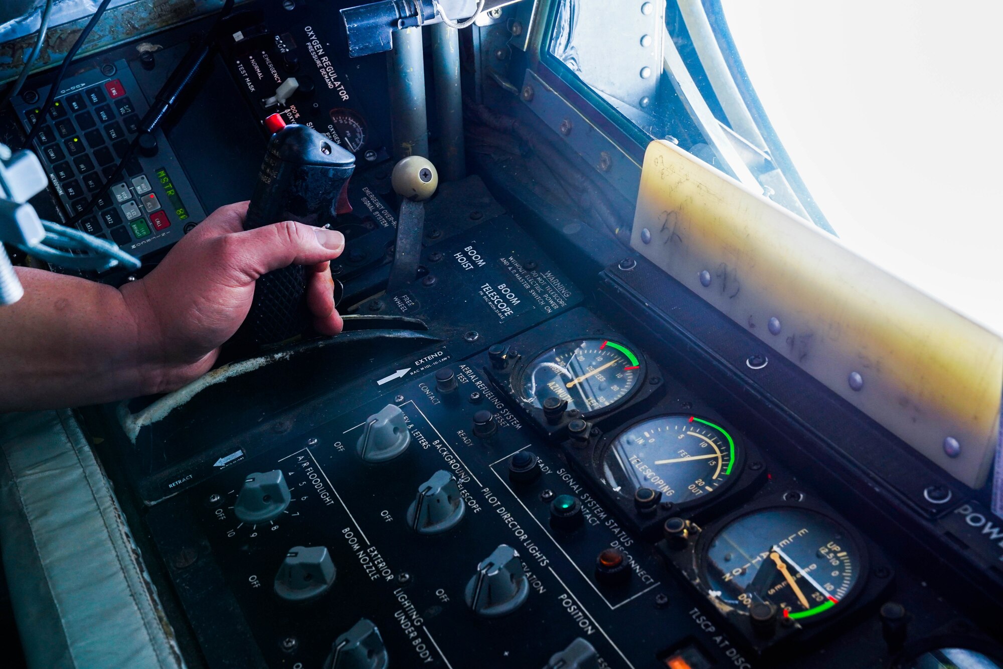 Master Sgt. Cal Codeiro, 203d Airlift Squadron, boom operator, refuels a C-17 Globemaster III during a refueling exercise around the Hawaiian Islands, October 18, 2021. The boom operator is stationed in the rear of the fuselage operating a boom to refuel aircraft in flight practicing air refueling readiness. (U.S. Air Force photo by Airman 1st Class Makensie Cooper)