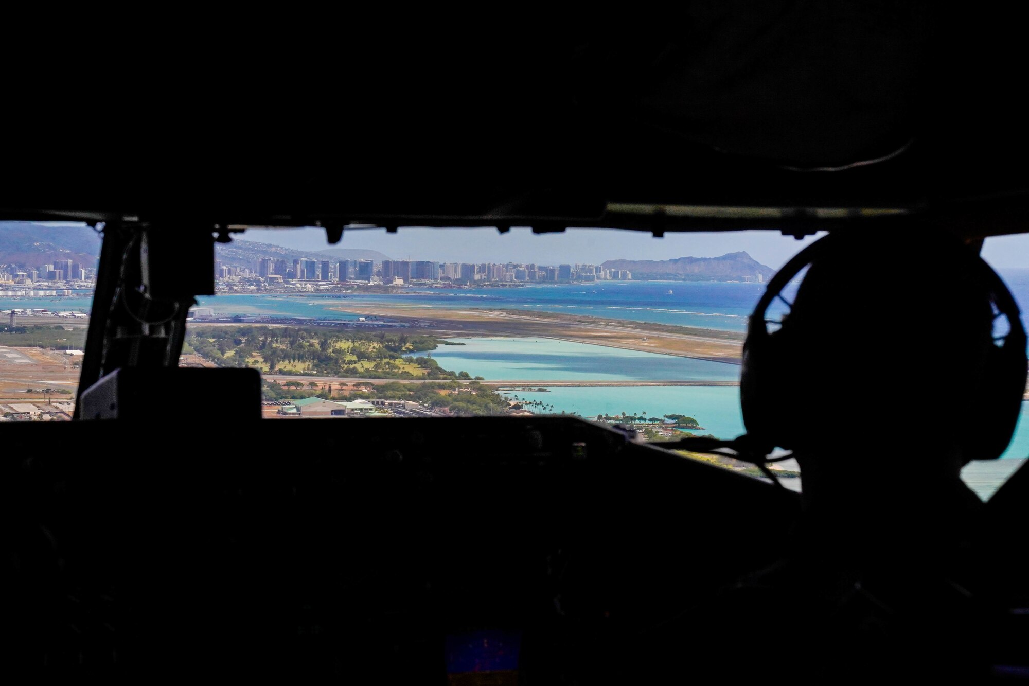 Lt. Col. Kelly Church, 203d Air Refueling Squadron, pilot flies a KC-135 Stratotanker during a refueling exercise at Joint Base Pearl Harbor-Hickam, October 18, 2021. The KC-135 Stratotanker provides aerial refueling support through a boom controlled by an operator stationed in the rear of the fuselage. (U.S Air Force photo by Airman 1st Class Makensie Cooper)