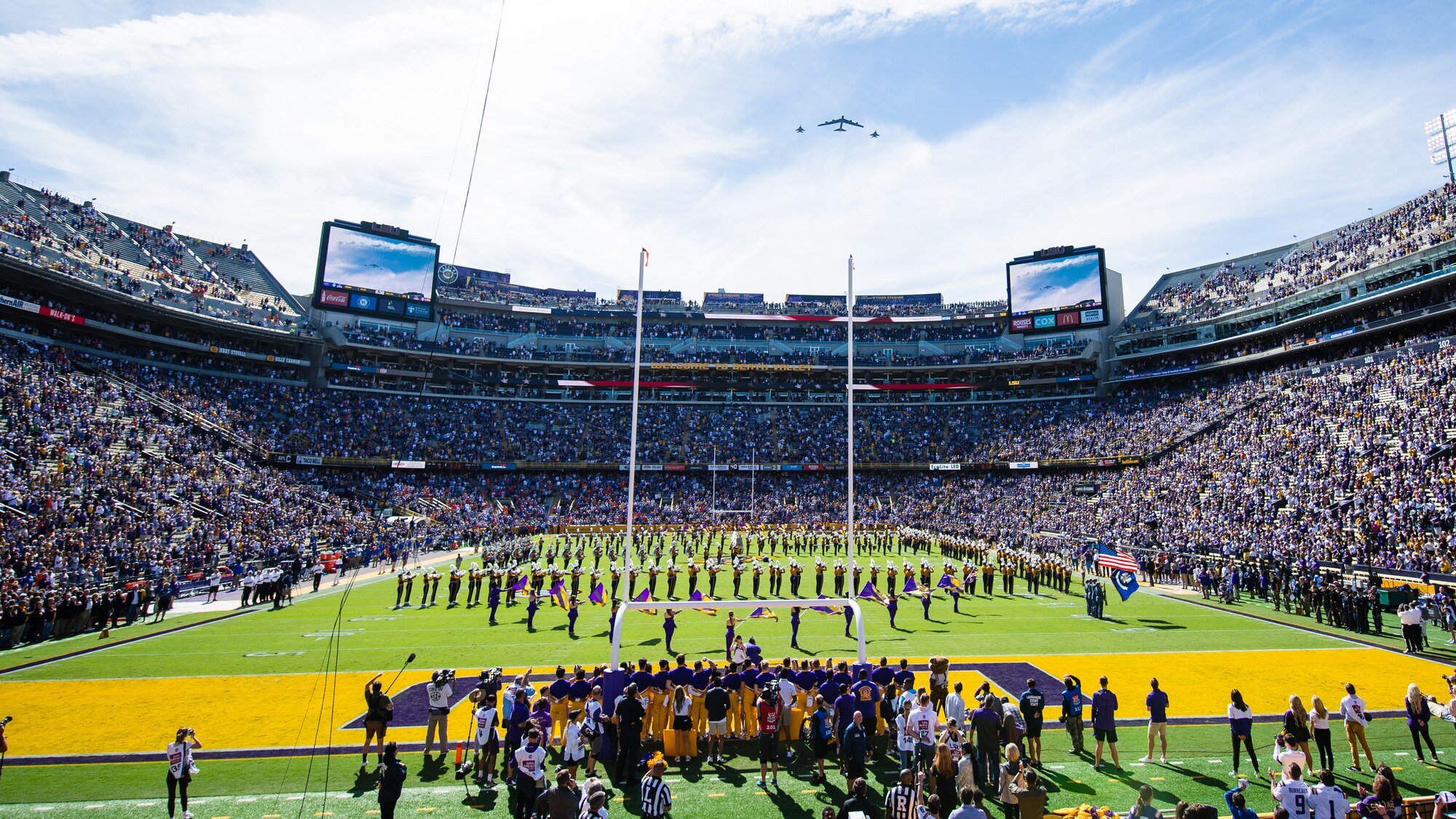 A B-52H Stratofortress and two F-15C Eagles flyover Louisiana State University's Tiger Stadium during a game Oct. 16, 2021, in Baton Rouge, Louisiana. Crews from the 343rd Bomb Squadron assigned to Barksdale Air Force Base, Louisiana, flew the B-52 and the 122nd Fighter Squadron from Naval Air Station Joint Reserve Base, New Orleans, flew the F-15s. (U.S. Air Force photo by Senior Airman Jacob B. Wrightsman)