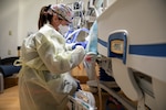 COEUR D’ALENE, Idaho – U.S. Army Capt. Alexis Acuna, a critical care nurse assigned to the 627th Hospital Center, provides care to a COVID positive patient during the COVID response operations at Kootenai Health regional medical center in Coeur d’Alene, Idaho, Sept. 26, 2021. U.S. Northern Command, through U.S. Army North, remains committed to providing flexible Department of Defense support to the whole-of- government COVID response. (U.S. Army Photo by Sgt. Kaden D. Pitt)