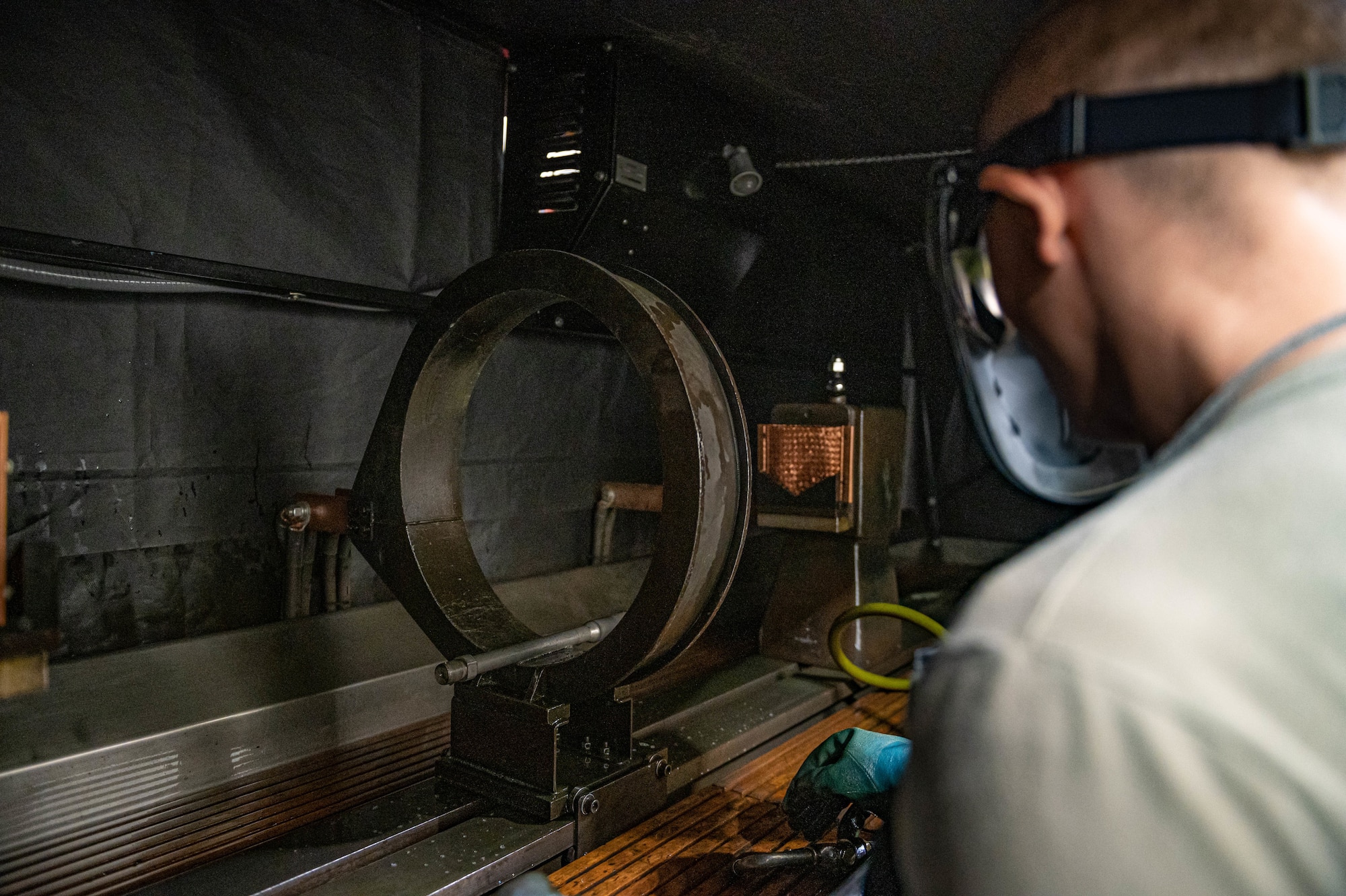 Technician energizes a boom fork shaft.