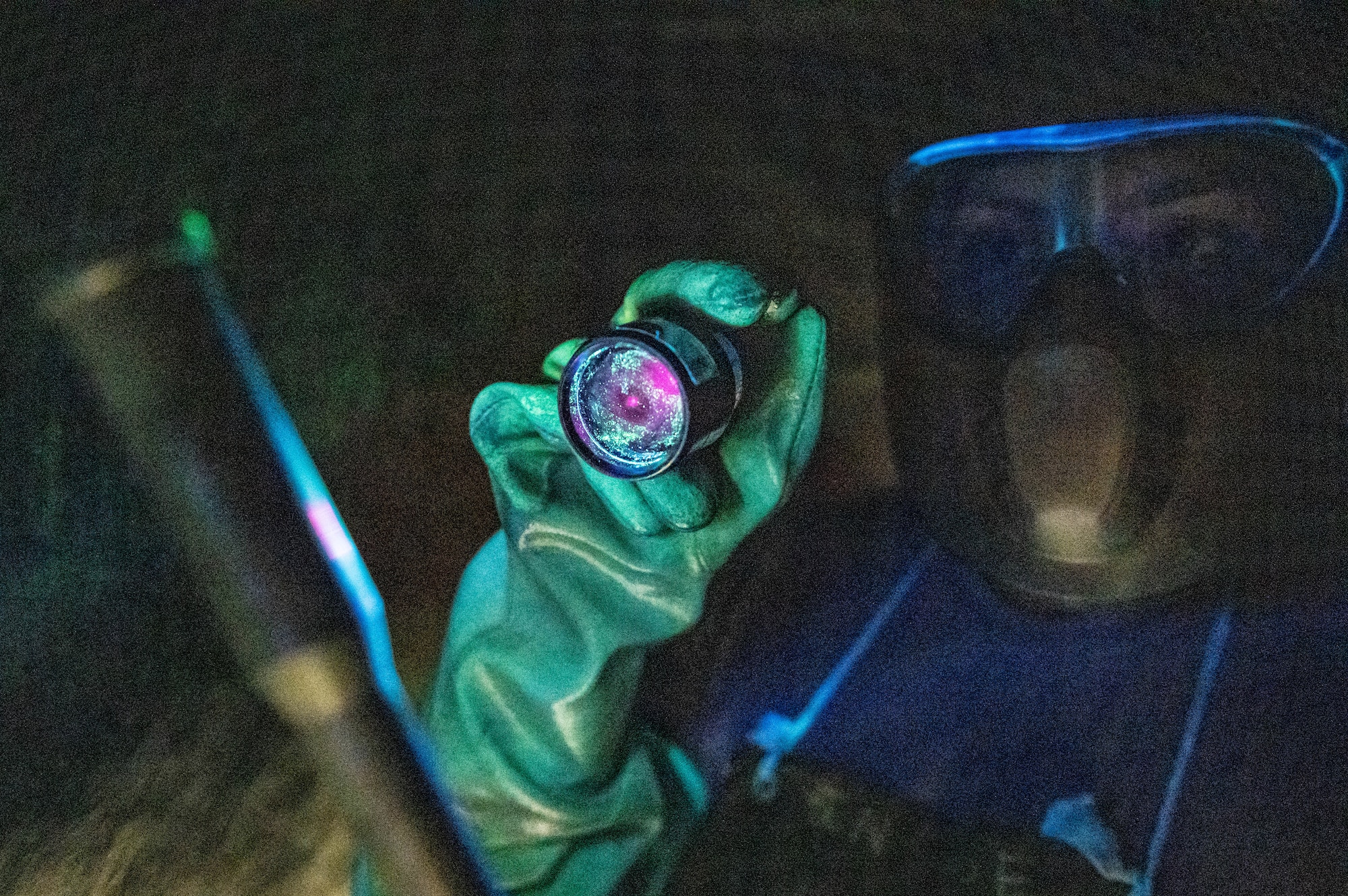 Technician inspects a boom fork shaft.