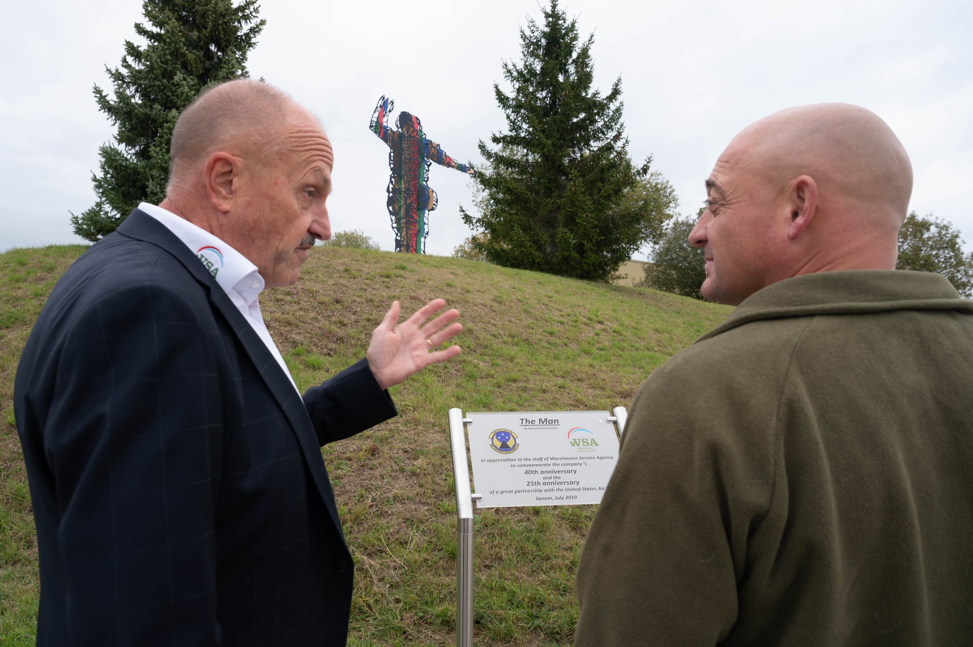 Paul Weckering, Warehouse Service Agency operations manager speaks with Brig. Gen. George T. Dietrich, USAFE director of logistics, engineering and force protection.