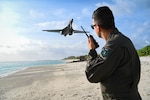 Photo of U.S. Air Force Airman watching flight of B-1 Lancer