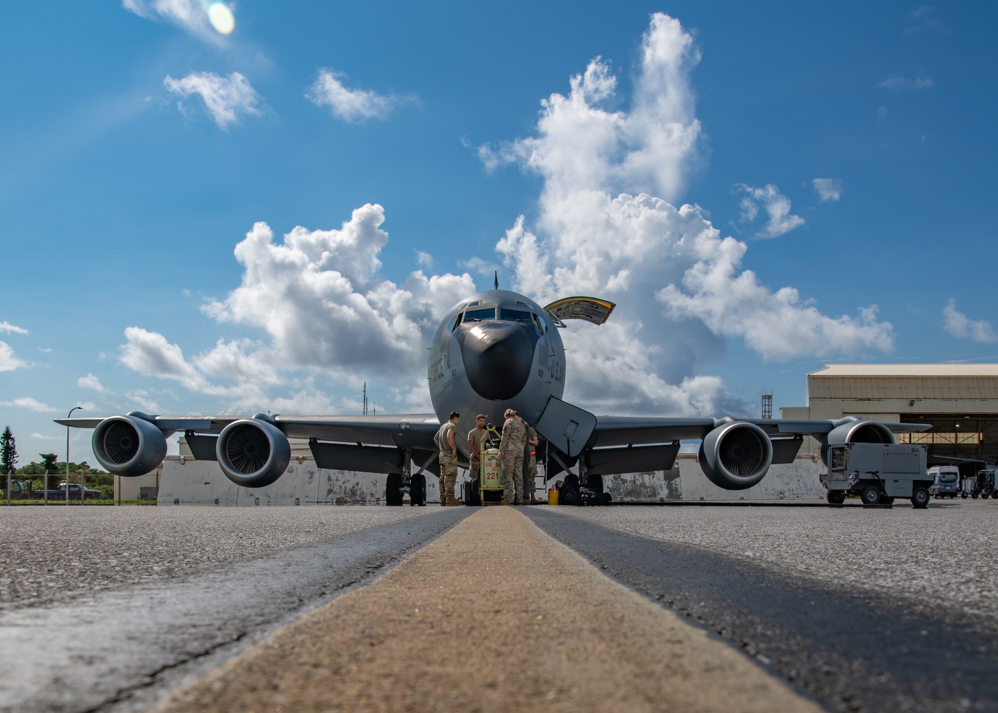 Aircrew stand in front of a KC-135.