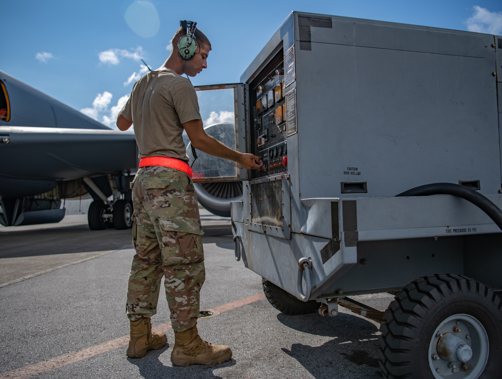 An Airman talks on a headset.