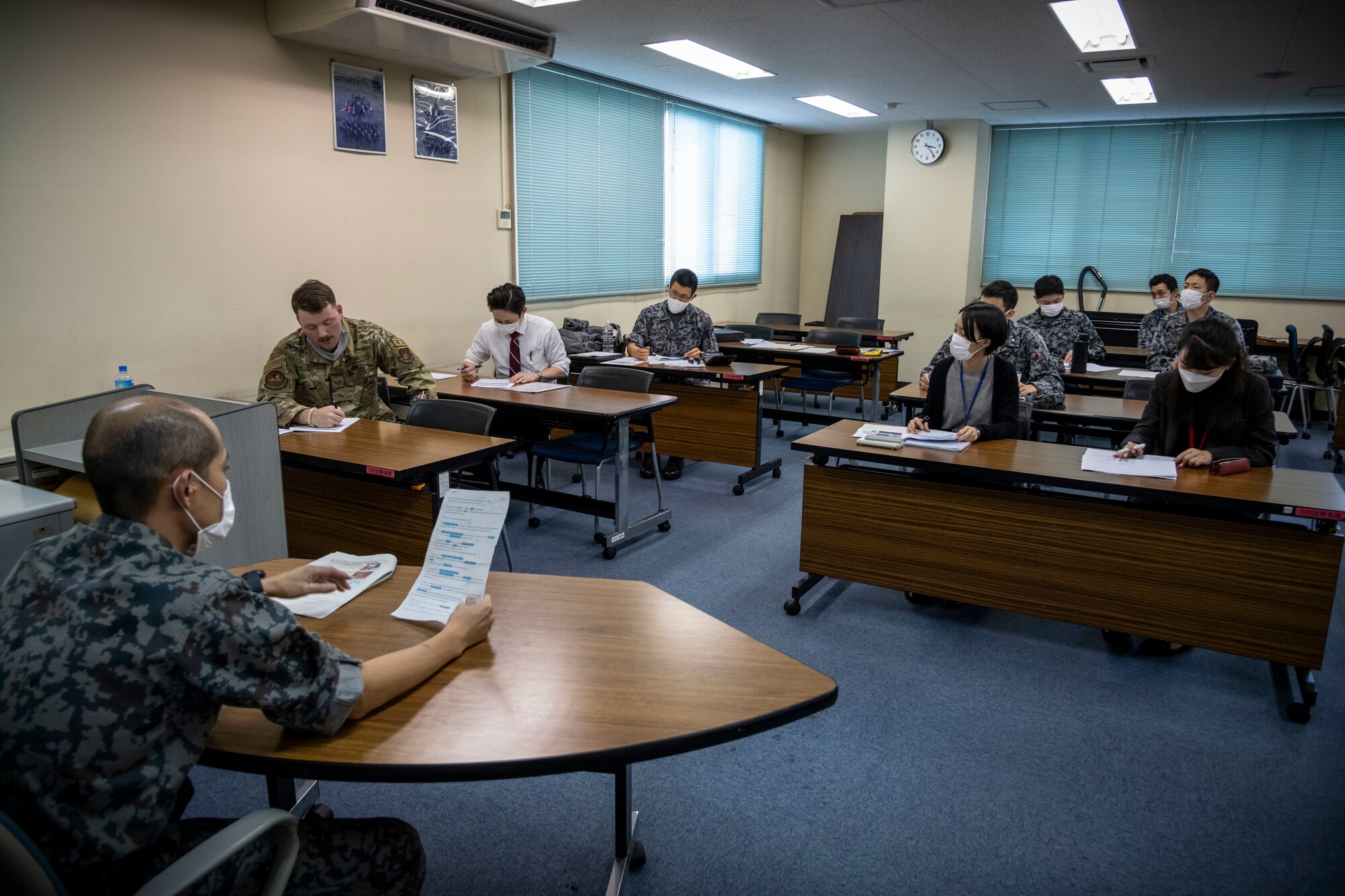 Japan Air Self-Defense Force (JASDF) airmen practice presentations for the Northern Air Defense Force (NADF) English Competition at Misawa Air Base, Japan, Oct. 14, 2021. The NADF English Competition is a tournament open for all the uniformed JASDF personnel to compete in their English proficiency. (U.S. Air Force photo by Senior Airman China M. Shock)