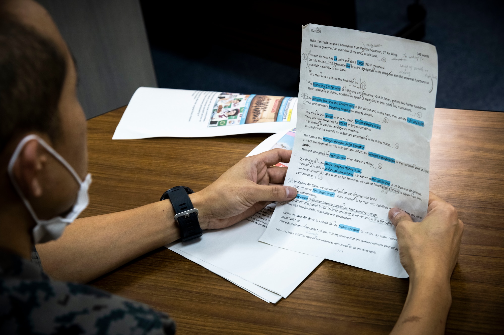 A Japan Air Self-Defense Force airman reads a script at Misawa Air Base, Japan, Oct. 14, 2021. The Northern Air Defense Force (NADF) English competition consists of participants preparing a presentation in English for the judges, receiving a score on their grammar, tone of voice, pronunciation and other criterion. (U.S. Air Force photo by Senior Airman China M. Shock)