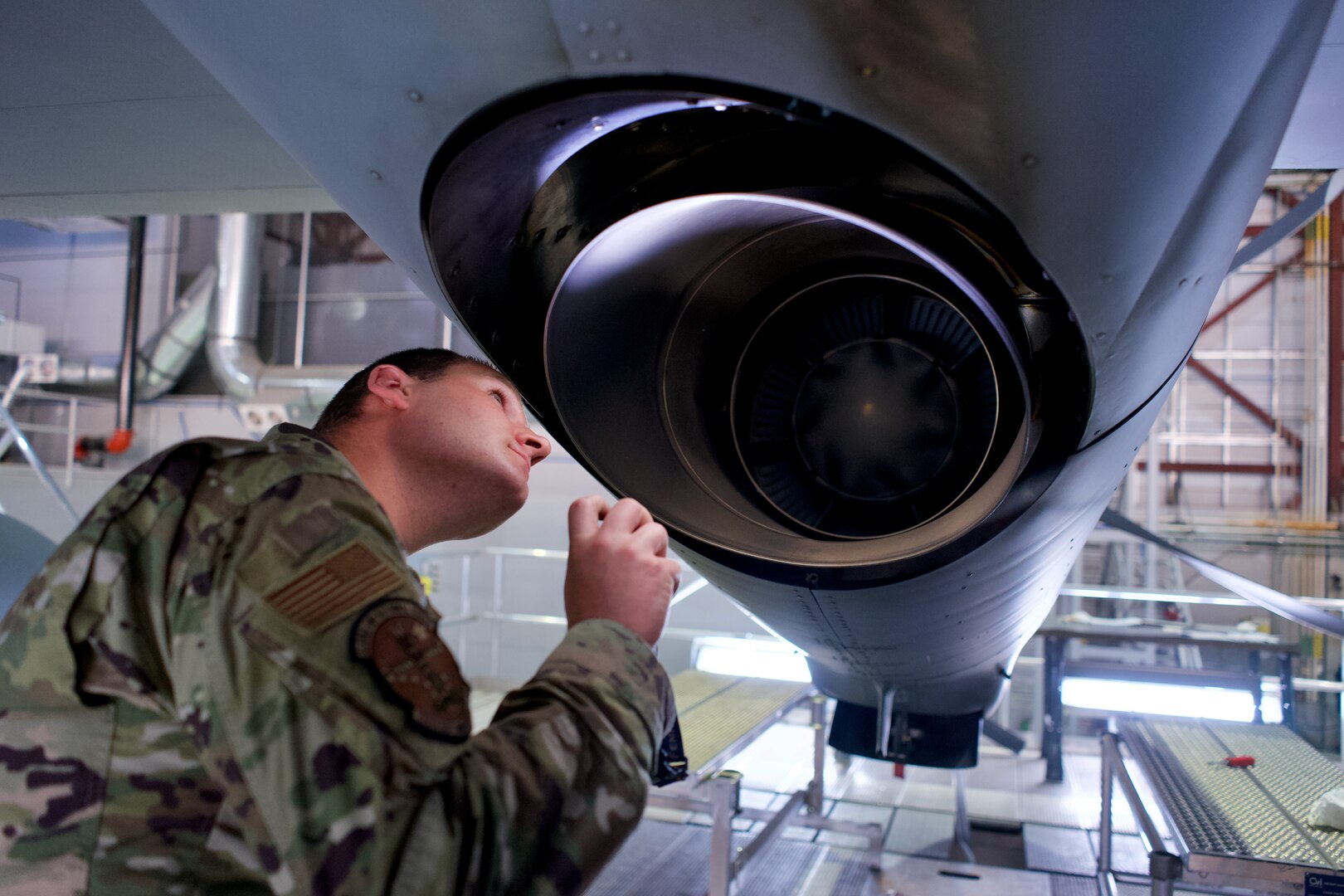 Alaska Air National Guard Airman 1st Class Brad Payton, an HC-130J Combat King II crew chief with 176th Aircraft Maintenance Squadron, inspects a 211th RQS HC-130 engine exhaust Oct. 4, 2021, at Joint Base Elmendorf-Richardson, Alaska. Payton recently completed mission-essential skills training following technical school and is pursuing a civilian career in aviation maintenance.