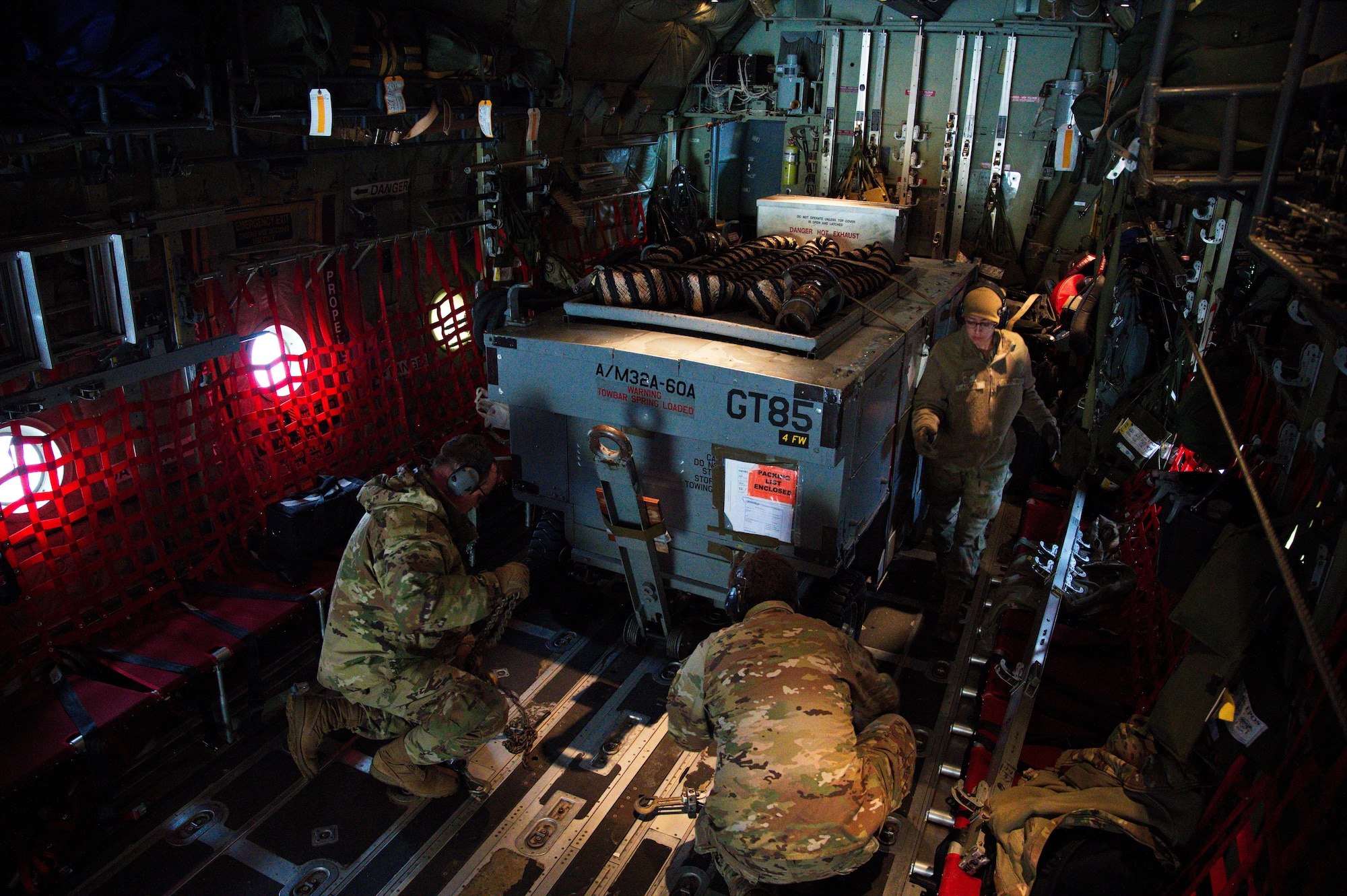 U.S. Air Force Airmen from the 435th Contingency Response Squadron secure a load to a C-130J Super Hercules during Operation Castle Forge at Larissa Air Base, Greece, Oct. 15, 2021. The 435 CRS is a scalable, cross-functional, rapidly deployable force designed to assess and open air bases, and perform initial airfield operations enabling the rapid standup of combat operations. Castle Forge is a U.S. Air Forces Europe-Air Forces Africa-led joint, multinational training event. It provides a dynamic, partnership-focused training environment that raises the U.S. commitment to collective defense in the Black Sea region while enhancing interoperability alongside NATO allies. (U.S. Air Force photo by Senior Airman Branden Rae)