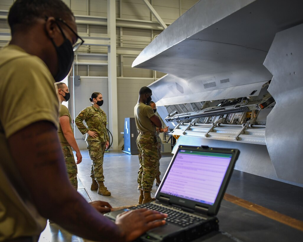 Staff Sgt. Alyxandra Anguiano teaches weapons Airmen