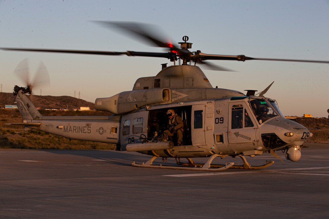 A U.S. Marine UH-1Y Venom helicopter with Marine Light Attack Helicopter Squadron 775, Marine Aircraft Group 41, 4th Marine Aircraft Wing, lands in a helicopter landing zone at Red Beach on Marine Corps Base Camp Pendleton, Californina, Oct. 15, 2021. The reservists of HMLA-775, along with the other squadrons on Marine Corps Air Station Camp Pendleton, provide aviation support that enables I Marine Expeditionary Force, Camp Pendleton tenant commands and visiting units to maintain and enhance their mission capabilities and combat readiness. (U.S. Marine Corps photo by Cpl. Andrew Cortez)