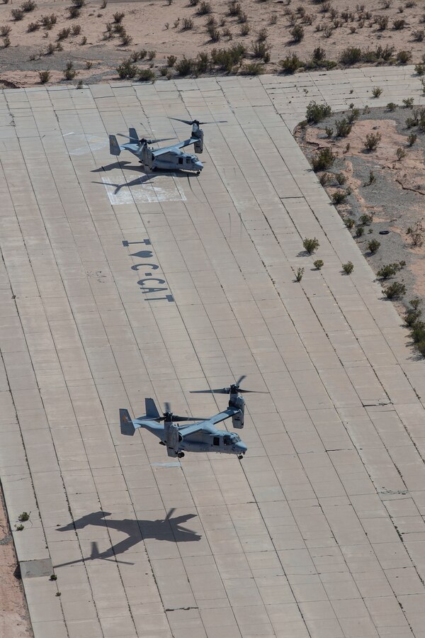 Two U.S. Marine MV-22B Ospreys with Marine Medium Tiltrotor Squadron 764, Marine Aircraft Group 41, 4th Marine Aircraft Wing, land on Holtville Airfield during a combined training operation with Marine Light Attack Helicopter Squadron 775, MAG-41, 4th MAW, near El Centro, California, Oct. 17, 2021. The reservists of HMLA-775 and VMM-764, along with other active duty aviation squadrons on the West Coast, provide aviation support that enables I Marine Expeditionary Force units to maintain and enhance their mission capabilities and combat readiness. (U.S. Marine Corps photo by Cpl. Andrew Cortez)