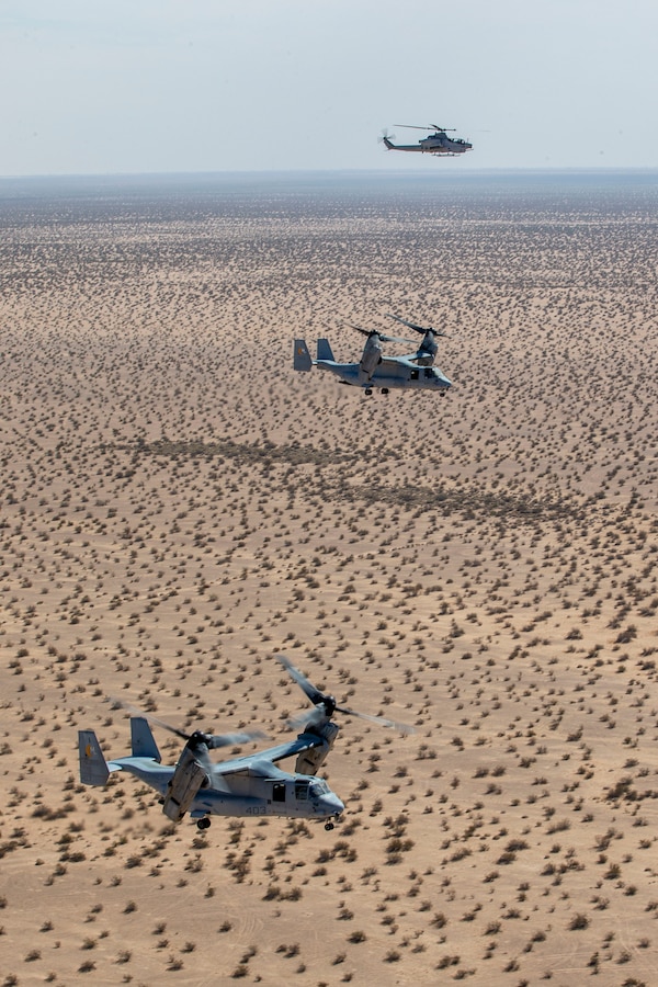 Two U.S. Marine MV-22B Osprey’s with Marine Medium Tiltrotor Squadron 764, Marine Aircraft Group 41, 4th Marine Aircraft Wing, fly alongside an AH-1Z Viper helicopter from Marine Light Attack Helicopter Squadron 775, MAG-41, 4th MAW, to Holtville Airfield during a combined operation near El Centro, California, Oct. 17, 2021. The reservists of HMLA-775 and VMM-764, along with other active duty aviation squadrons on the West Coast, provide aviation support that enables I Marine Expeditionary Force units to maintain and enhance their mission capabilities and combat readiness. (U.S. Marine Corps photo by Cpl. Andrew Cortez)