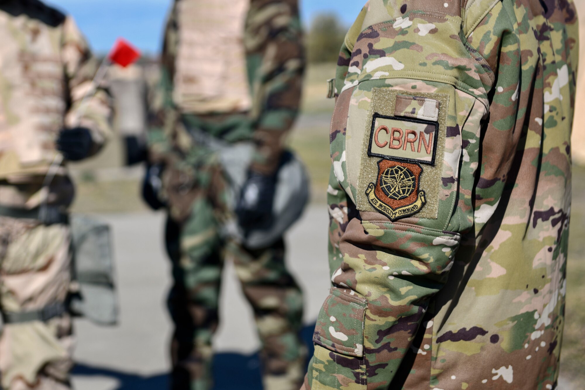 U.S. Air Force Airman 1st Class Jacob Sandlin, 92nd Civil Engineer Squadron Emergency Management specialist, wears a chemical, biological, radiological and nuclear defense patch during a large readiness exercise at Fairchild Air Force Base, Washington, Oct. 7, 2021. CBRN is one function of the Emergency Management office, along with hazardous material response and emergency management operations. (U.S. Air Force photo by Senior Airman Ryan Gomez)