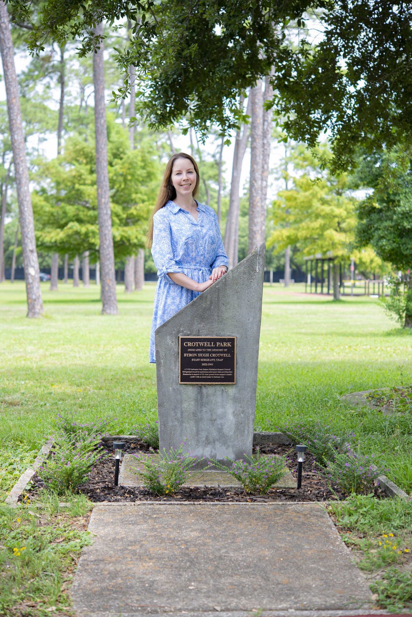 Casey Harper, 81st Training Support Squadron faculty development instructor, poses for a photo at the Crotwell Park at Keesler Air Force Base, Mississippi, Aug. 6, 2021. Harper took initiative to repair Staff Sgt. Byron Crotwell's Memorial. (U.S. Air Force photo by Senior Airman Kimberly Mueller)