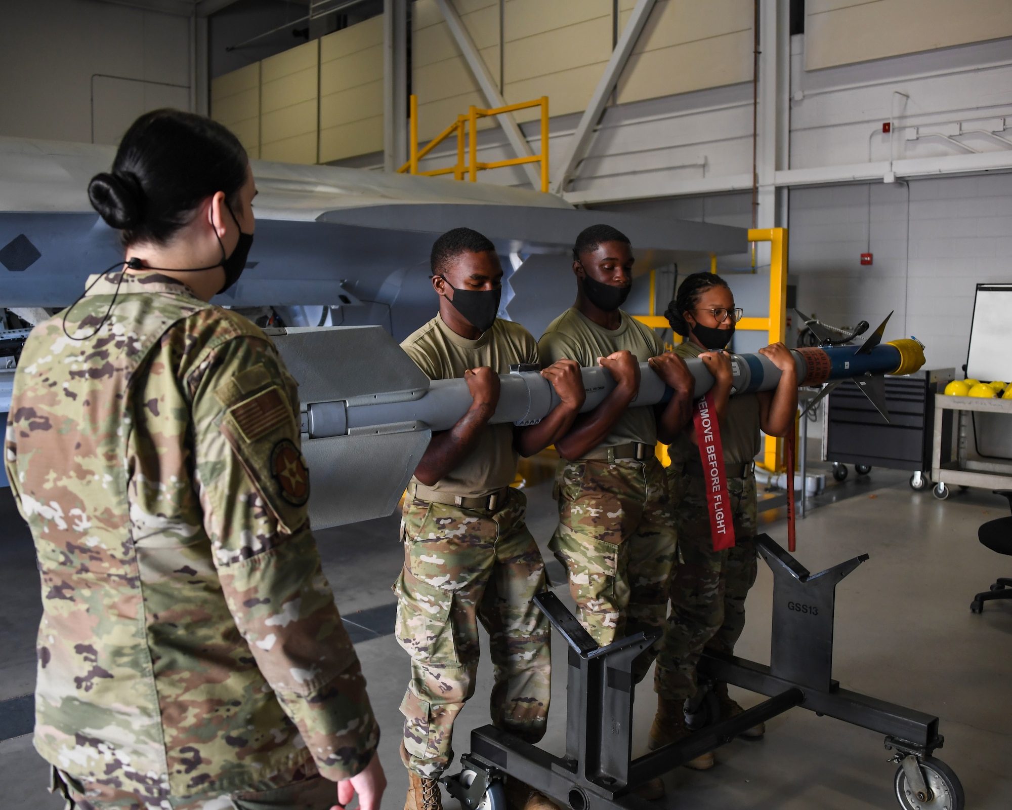 Staff Sgt. Alyxandra Anguiano teaches weapons Airmen