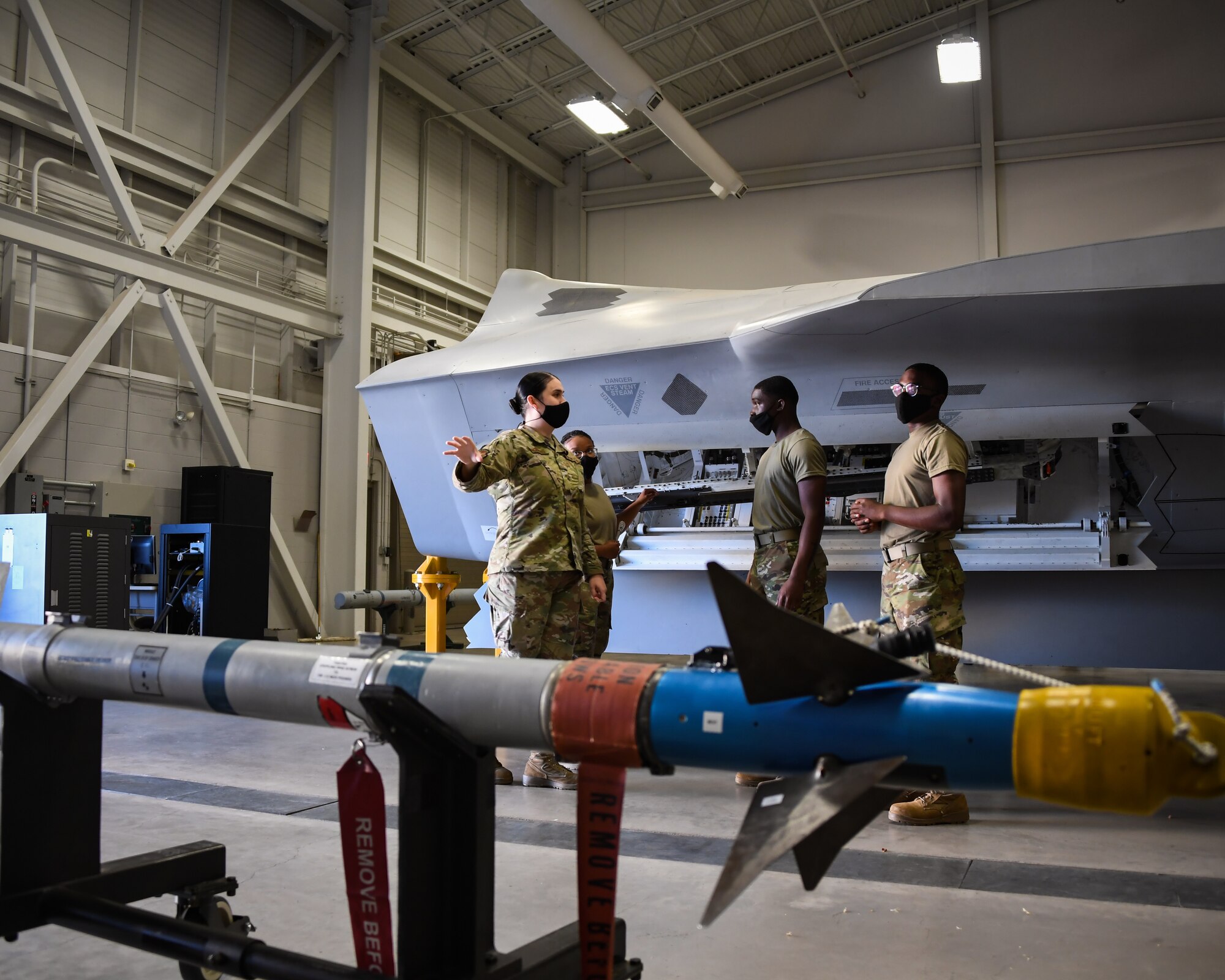 Staff Sgt. Alyxandra Anguiano teaches weapons Airmen