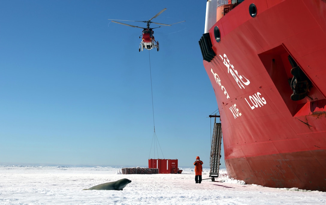 China’s research icebreaker Xuelong, or Snow Dragon, unloads cargo on sea ice near China-built Zhongshan Station in Antarctica