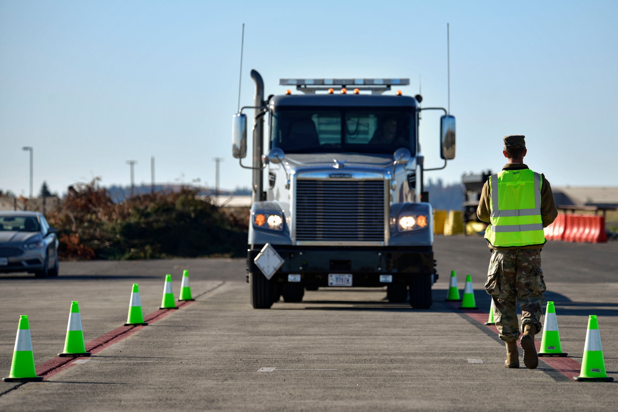 U.S. Air Force Staff Sgt. Joshua McDonald, 92nd Logistics Readiness Squadron Training, Validation and Operations examiner, conducts a commercial driver’s license (CDL) evaluation at Fairchild Air Force Base, Washington, Oct. 7, 2021. The 92nd LRS’s CDL program was certified by the American Association of Motor Vehicle Administrators to standardize commercial vehicle training. (U.S Air Force photo by Senior Airman Ryan Gomez)