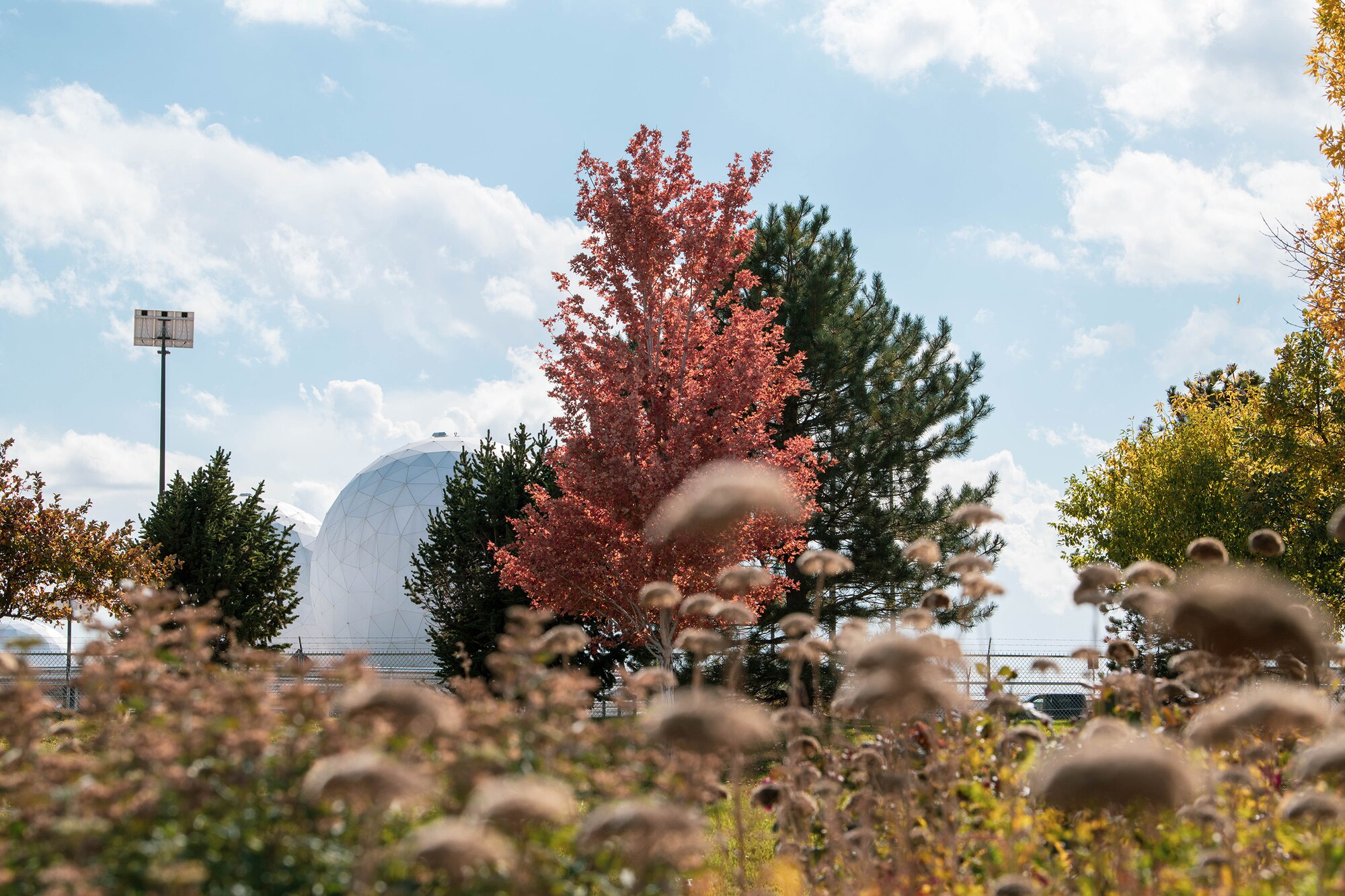 Two radomes providing strategic and theater missile warning for the United States and its international allies are photographed amid the autumn landscape on Oct. 19, 2021, on Buckley Space Force Base, Colo.
