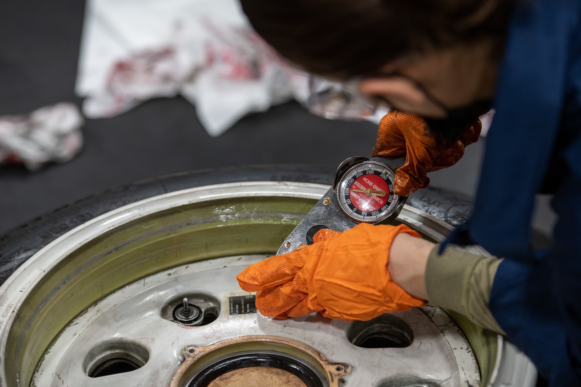 U.S. Air Force 2nd Lt. Kristin Rowe, 56th Equipment Maintenance Squadron support staff section commander, torques the valve stem on an F-35A Lightning II main wheel hub assembly Oct. 14, 2021, at Luke Air Force Base, Arizona. During the wheel and tire assembly process, Airmen will torque the valve stem 50-60 inch pounds, to ensure there is a tight seal and no air loss on the tire. The wheel and tire shop provides essential and reliable aircraft parts for the F-35A and F-16 Fighting Falcon, supporting the world’s greatest fighter pilots and combat-ready Airmen. (U.S. Air Force photo by Staff Sgt. Collette Brooks)