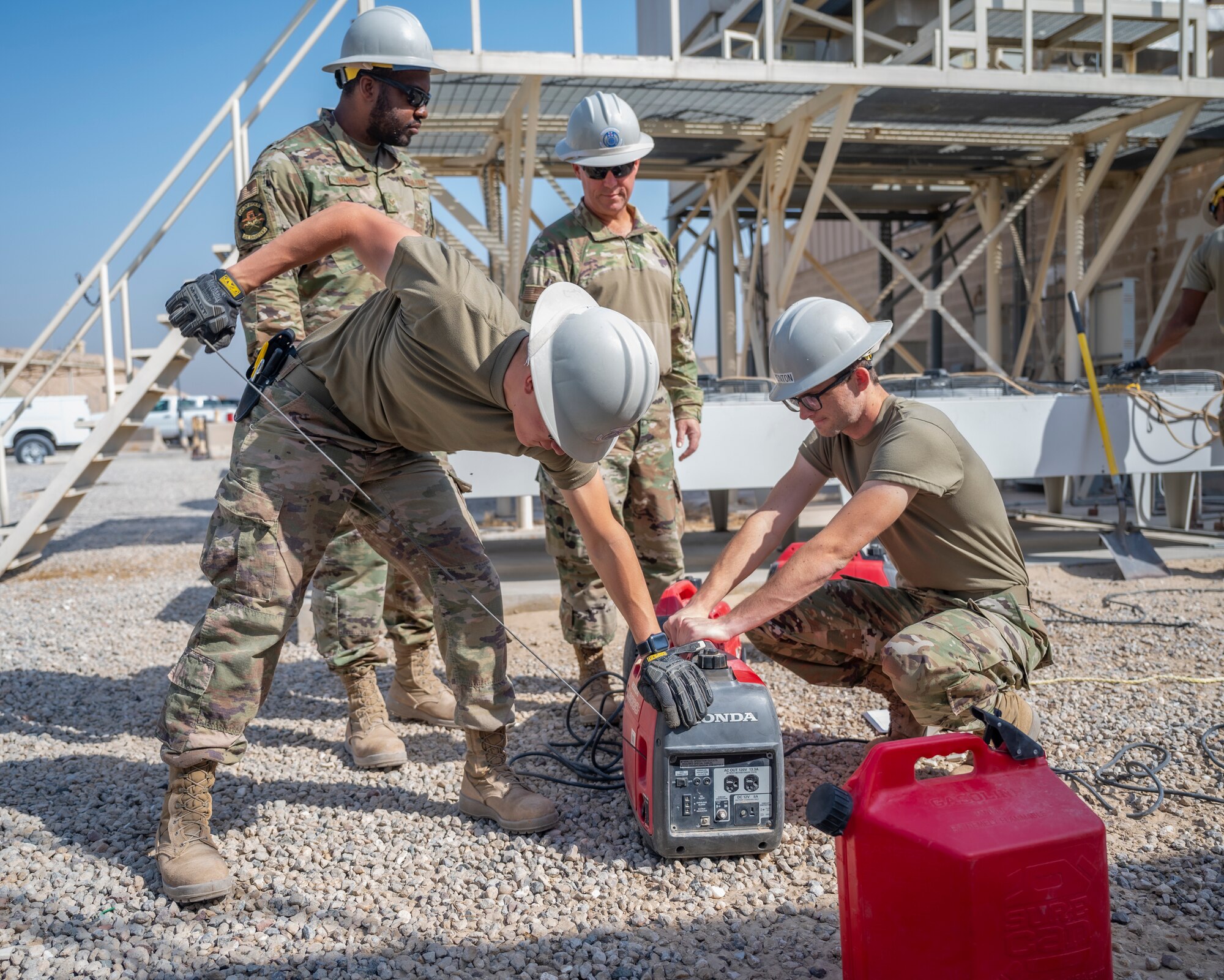 Members of the U.S. Air Forces Central, Air Force Forces A67 Engineering and Installation team start a generator at Ali Al Salem Air Base, Kuwait, Oct. 19, 2021.