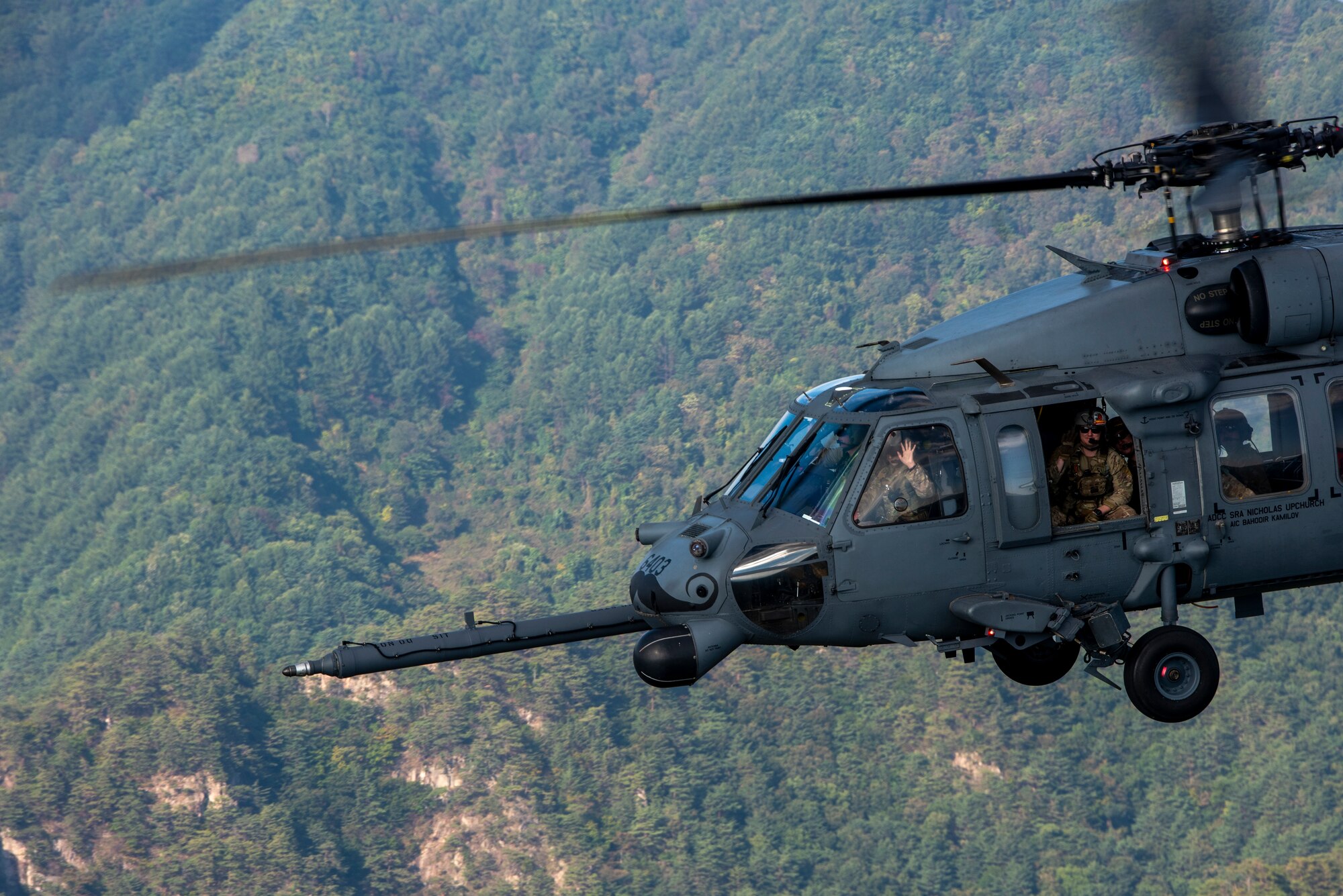 An HH-60G Pave Hawk flies over the Republic of Korea during a combat search and rescue training event
